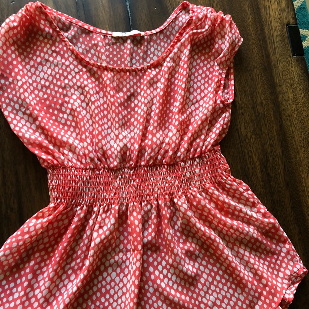 Peplum top. NWOT. Medium. Tangerine/Cream color